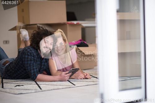 Image of Young couple moving in a new flat