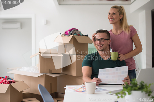 Image of Young couple moving in a new home