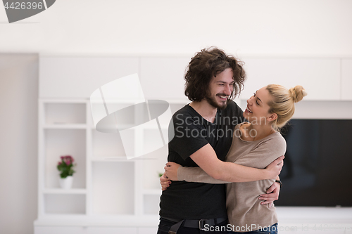 Image of couple hugging in their new home