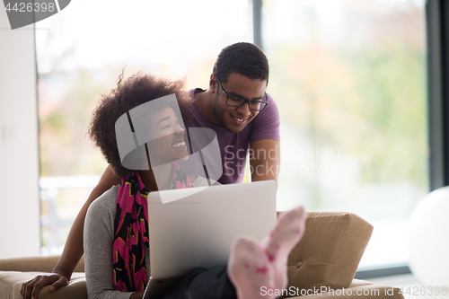 Image of african american couple shopping online