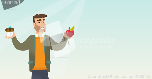 Image of Man choosing between apple and cupcake.