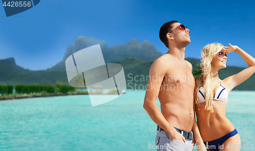 Image of happy couple on over bora bora background