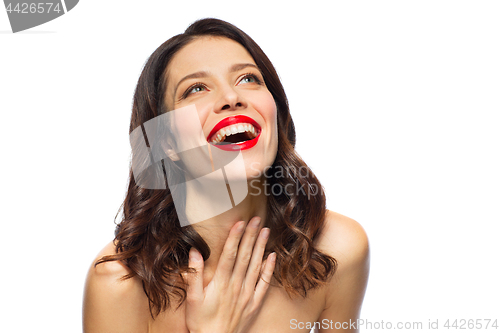 Image of beautiful laughing young woman with red lipstick
