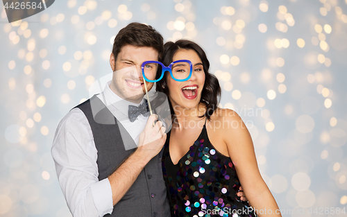 Image of happy couple with party glasses having fun