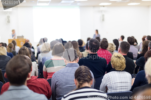 Image of Woman giving presentation on business conference.