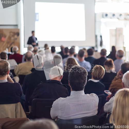 Image of Business speaker giving a talk at business conference event.