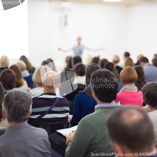 Image of Woman giving presentation on business conference.