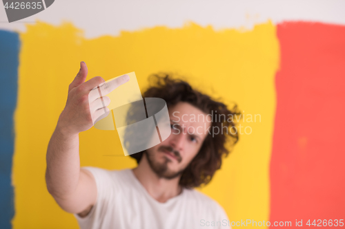 Image of young man with funny hair over color background