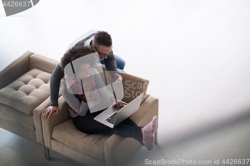 Image of multiethnic couple shopping online