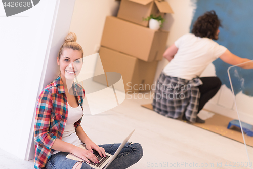 Image of Happy couple doing home renovations