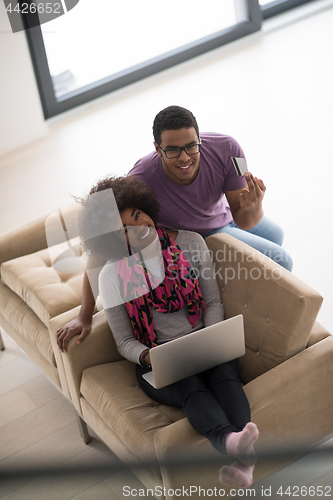 Image of african american couple shopping online