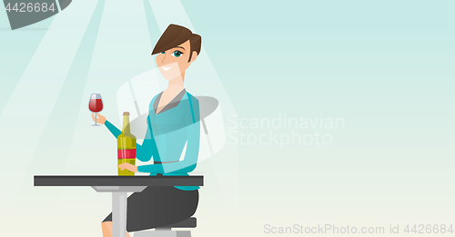 Image of Woman drinking wine in the restaurant.