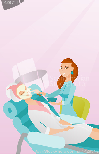 Image of Woman in beauty salon during cosmetology procedure