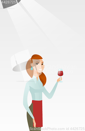 Image of Waitress holding a glass of wine in hand.