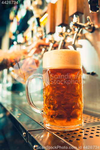 Image of Glass of beer with barrel, bottle and fresh hops still-life