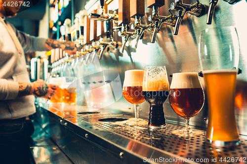 Image of Glass of beer with barrel, bottle and fresh hops still-life