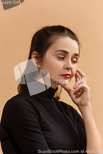 Image of Young serious thoughtful business woman. Doubt concept.