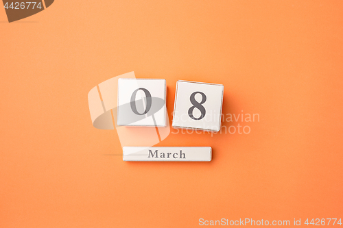 Image of View from above with copy space. Background for woman day, 8 March. Orange table.