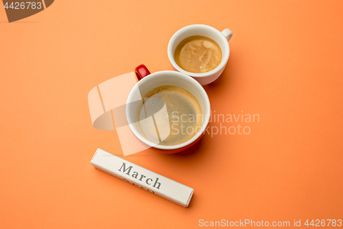 Image of View from above with copy space. Background for woman day, 8 March. Orange table.
