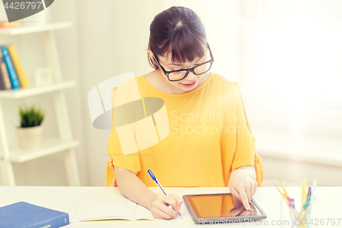 Image of asian woman student with tablet pc at home