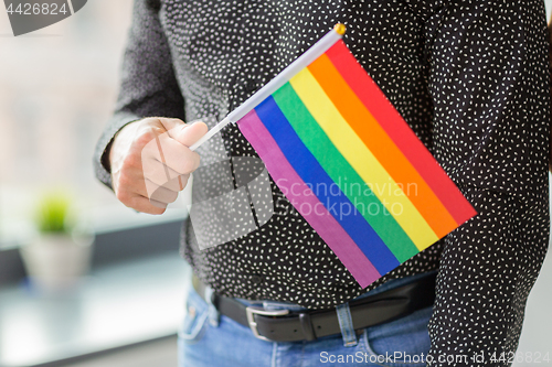 Image of close up of man with gay pride flag