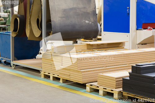 Image of wooden boards at workshop or woodworking plant