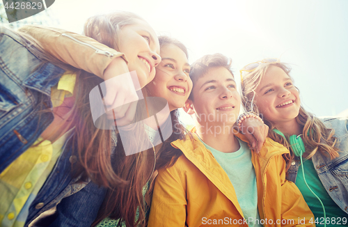 Image of happy teenage students or friends outdoors