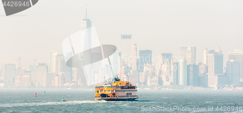 Image of Staten Island Ferry and Lower Manhattan Skyline, New York, USA.