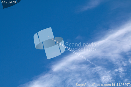 Image of Plane, contrail and Cirrocumulus Clouds