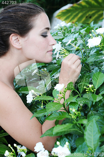 Image of Smelling flowers