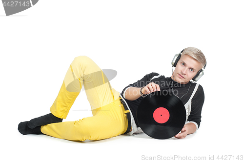 Image of Young man with vinyl record