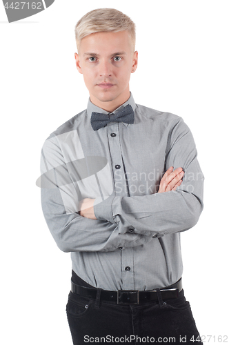 Image of Male standing with crossed arms