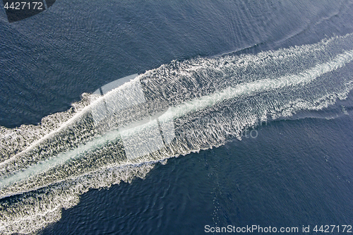 Image of Trail of a motorboat on the water, aerial view