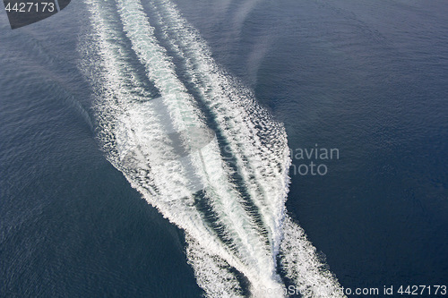 Image of Trail of a motorboat on the water, aerial view
