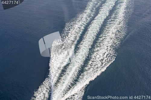 Image of Trail of a motorboat on the water, aerial view