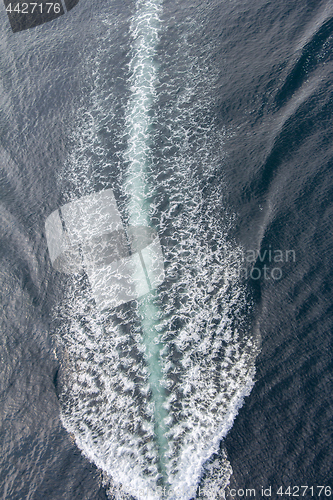 Image of Trail of a motorboat on the water, aerial view