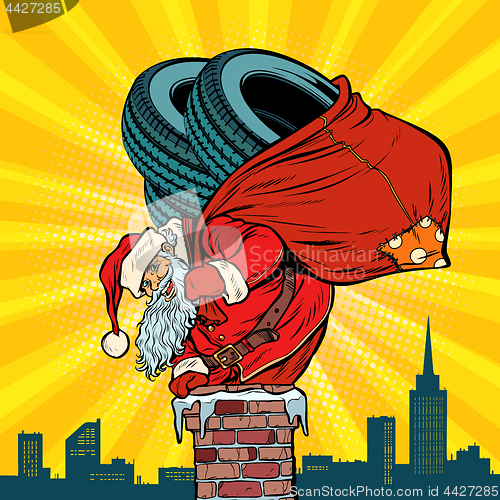 Image of car winter tires. Santa Claus with gifts climbs into the chimney