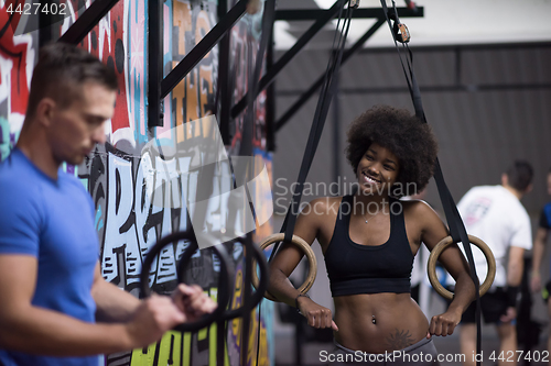 Image of Portrait of multiethnic couple  after workout at gym