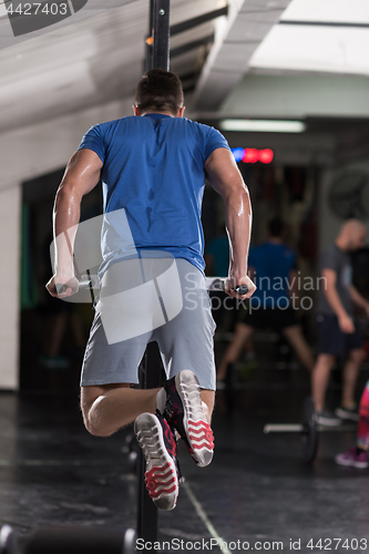 Image of man doing exercises parallel bars