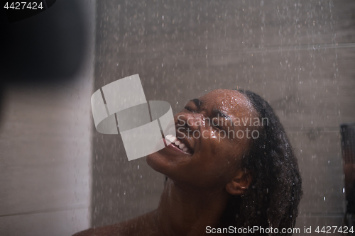 Image of African American woman in the shower