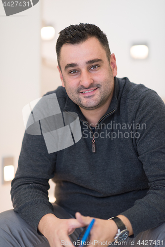 Image of man sitting on the stairs