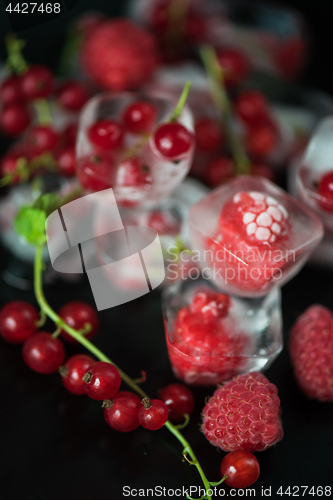 Image of Frozen berries on wooden table