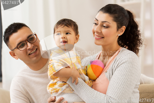 Image of happy family with baby daughter at home