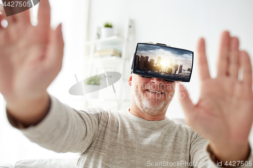 Image of old man in virtual reality headset or 3d glasses