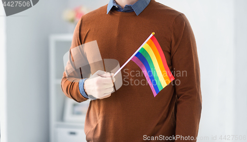 Image of close up of man with gay pride flag