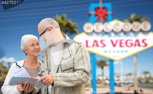 Image of senior couple with map travelling to las vegas