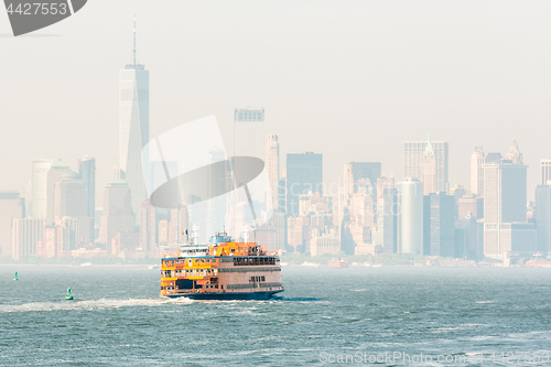 Image of Staten Island Ferry and Lower Manhattan Skyline, New York, USA.