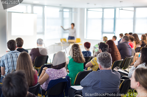 Image of Speaker giving presentation on business conference.