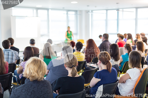 Image of Speaker giving presentation on business conference meeting.