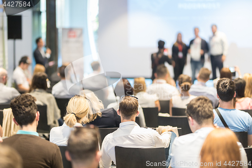 Image of Business speakers giving a talk at business conference event.